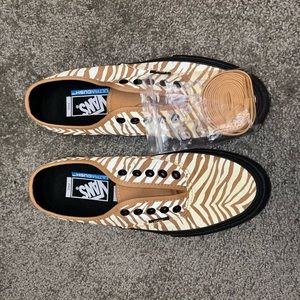 Brand new gold zebra Vans sneakers.